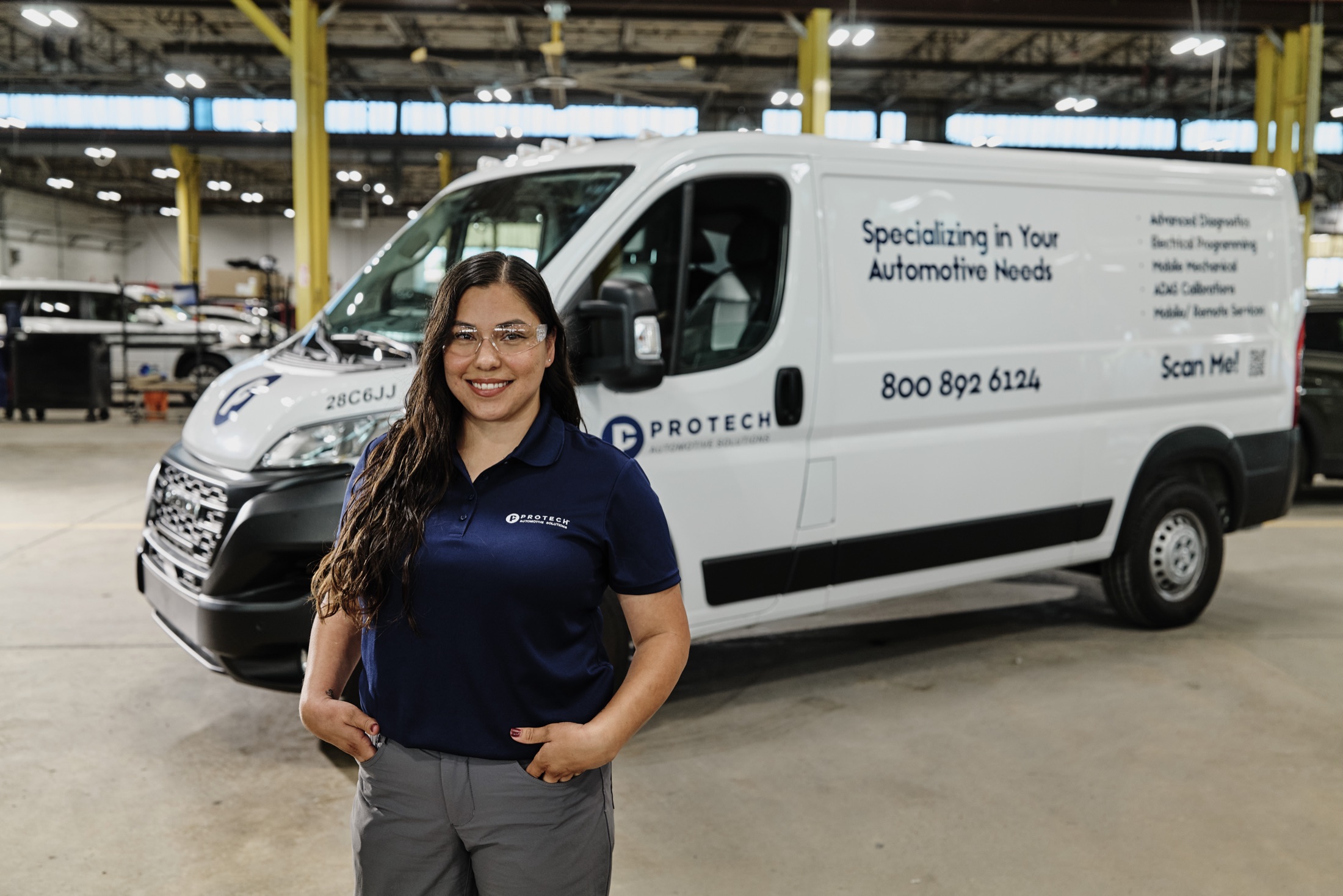 Protech team member beside a mobile service van